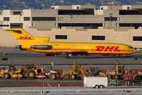 N784DH @ LAX - DHL (ASTAR Air Cargo) N784DH (FLT ER2964) from Wilmington (KILN) taxiing to the cargo terminal after landing on RWY 25R.
