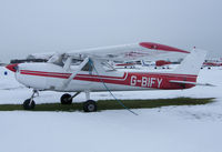 G-BIFY @ EGTC - Bonus Aviation C150 sitting in the snow at Cranfield. - by captainflynn