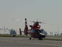 6590 @ POC - USCG Dolphin HH 65C crossing taxiway to parking apron - by Helicopterfriend