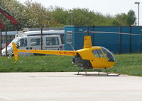 G-BLME @ EGTB - R22 ON THE HELI AIR APRON - by BIKE PILOT