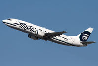 N780AS @ LAX - Alaska Airlines N780AS climbing out from RWY 25R. - by Dean Heald
