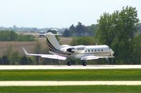 N424QS @ CID - Departing Runway 27 - by Glenn E. Chatfield