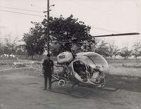 N2248W @ POC - Pomona Police Pilot standing by Pomona PD Bell - by Helicopterfriend