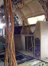 N2312G @ OPN - Inside Tooie rear cabin.  Some sort of avionics console. - by J. Michael Travis