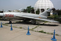 31584 - Shenyang J-5   Located at Datangshan, China - by Mark Pasqualino