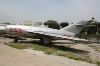 63635 - MiG-15 UTI - by Mark Pasqualino
