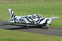 G-ZEBY @ EGBG - Striking colour scheme on this PIPER PA-28-140  at Leicester 2009 May Bank Holiday Fly-in - by Terry Fletcher