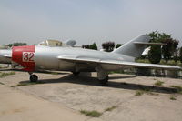 32 - MiG-15  Located at Datangshan, China - by Mark Pasqualino