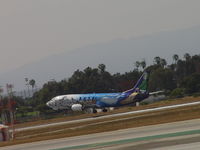 N705AS @ LAX - Mushing in for a landing on 24R - by Helicopterfriend