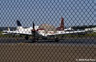 N9498L @ HEF - Sweet looking burgundy cat on the ramp