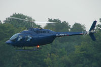 G-OCFD - One of the helicopters at Epsom on 2009 Derby Day