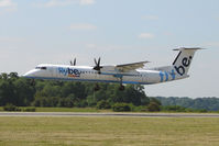 G-JECS @ EGGW - Flybe Dash 8 landing at Luton - by Terry Fletcher