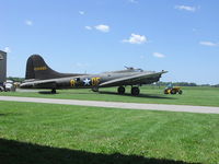 N3703G @ D52 - Memphis Belle being towed out of the hanger at Geneseo. - by Terry L. Swann