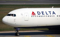 N199DN @ EDDT - Close shot of rolling by DELTA on the way to take off - by Holger Zengler