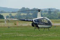 G-JHEW @ EGBS - R22 at Shobdon on the Day of the 2009 LAA Regional Strut Fly-in - by Terry Fletcher