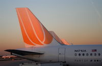 N471UA @ KORD - The sun sets on the tails of TED... - by Mark Kalfas