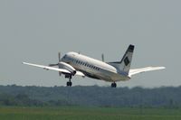 N727DL @ CID - Climbing out after departing Runway 13 - by Glenn E. Chatfield