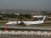 N404QX @ LAX - Horizon 2001 Bombardier DHC-8-402 rolling - by Steve Nation
