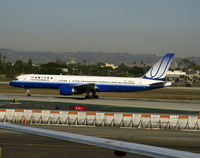 N596UA @ LAX - United 1998 757-222 in latest colors rolling on Runway 24L - by Steve Nation