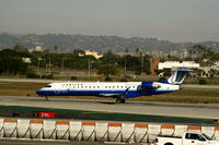 N744SK @ LAX - United Express 'Explus' 2005 Bombardier CL-600-2C10 in latest colors rolling on RW 24L - by Steve Nation