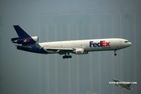 N594FE @ VHHH - Fedex landing on a very misty day - by Michel Teiten ( www.mablehome.com )