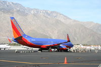 N908WN @ KPSP - Southwest 737-7H4, N908WN loading troops for a charter flight out of KPSP. - by Mark Kalfas