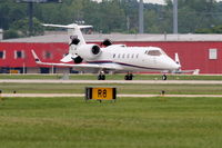 N24SR @ KDPA - Sears Roebuck Learjet 60, deploying reversers, arriving 20R KDPA after a trip from KAVL - by Mark Kalfas