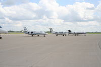 N80SL @ KDPA - Cessna 501 - N80SL, Piper Cheyenne III - N51KC and Wal-Mart Learjet 31A - N834AF on the ramp KDPA - by Mark Kalfas