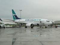 C-FWAD @ CYYG - Aircraft in Charlottetown, PE on a rainy day - by ralph spielman