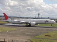 JA734J @ EGLL - JAL touching down - by Robert Kearney