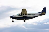 N126AR @ PABE - Frontier Alaska Cessna 208 landing Runway 11 - by Martin Prince, Jr