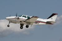 N58KT @ OSH - 2000 Raytheon Aircraft Company 58, c/n: TH-1955 - by Timothy Aanerud