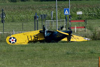 N56028 @ EBDT - Seconds after the crash. The Ryan came in, crossed the light poles and dived straight down. One severely and one lightly injured. The aircraft is a write off...