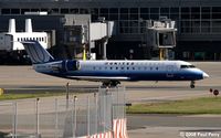 N650ML @ IAD - A Bombardier easing through the terminal area - by Paul Perry