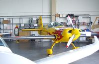 D-EXFT @ EDKB - Extra EA-200 in a maintenance hangar during the Bonn-Hangelar centennial jubilee airshow - by Ingo Warnecke