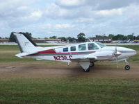 N231LC @ KOSH - Beech 58 - by Mark Pasqualino