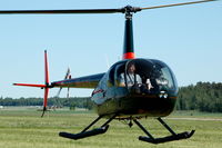 SE-JJG @ ESOW - Robinson R44 used for sight-seeing from Västerås Hässlö airport, Sweden - by Henk van Capelle