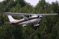 N3192U @ W96 - 1962 Cessna 182F Skylane N3192U climbing out from RWY 10. - by Dean Heald