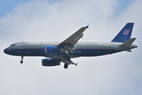 N409UA @ KORD - United Airlines A320-232, N409UA, 4R approach KORD - by Mark Kalfas