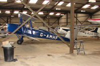 G-AMHF @ EGBK - Tiger Moth hangered at Sywell - by Terry Fletcher