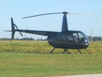 N144EH @ I12 - Parked in the grass at Sidney, Ohio during the EAA fly-in. - by Bob Simmermon