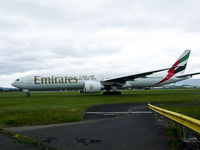 A6-EBZ @ EGPF - Emirates 26 taxiing to the runway,for departure to DXB - by Mike stanners