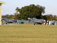 PM631 @ EGBP - taxiing past G-RRGN Spitfire MK.XIX - by Chris Hall