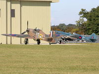 LF363 @ EGBP - taxiing past G-RRGN Spitfire MK.XIX - by Chris Hall