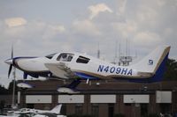 N409HA @ KOSH - Departing OSH on 27 - by Todd Royer
