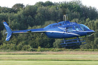 G-OJPS @ EGCB - 35 year old Jet Ranger setting down at Barton. - by MikeP