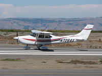 N7264X @ SQL - 1999 Cessna 182S 'Dorothy' (on spine) taking-off for quick flight to Monterey Penisula Airport - by Steve Nation