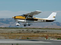 N8267L @ SQL - 1967 Cessna 172H landing - by Steve Nation