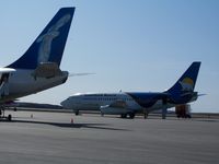 C-GOPW @ CYRT - C-GOPW at Rankin Inlet, NU 2009aug17 with C-FNVT's tail in foreground - by Philippesdad