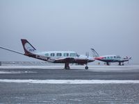 C-FEON @ CYRT - C-FEON at Rankin Inlet, NU 2009oct26 with C-GKSA in background - by Philippesdad